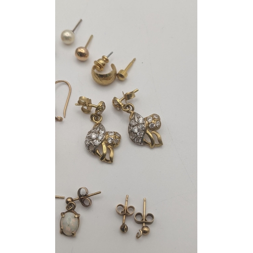 134 - A pair of gold and pace stone earrings tested as 15ct gold 4.6g together with other yellow metal ear... 