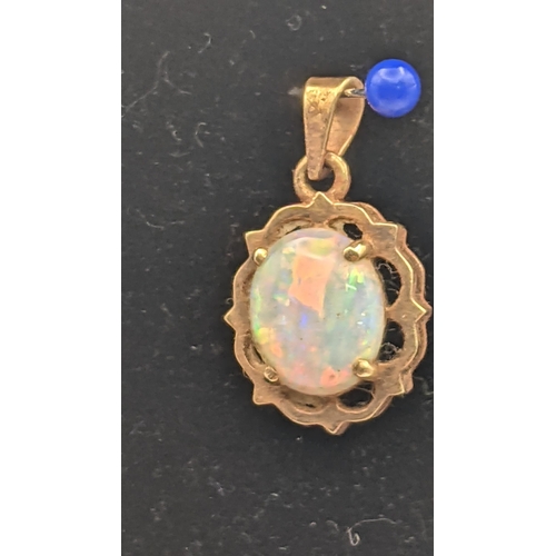 135 - A gold and opal pendant stamped 10k on a 9ct gold box link necklace 39cm L3.1g together with another... 