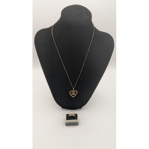 136 - A 9ct gold necklace 1.3g together with a gold coloured heart shaped pendant together with a gold rin... 