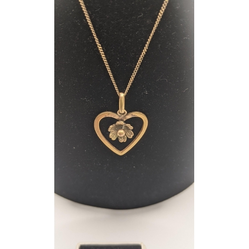 136 - A 9ct gold necklace 1.3g together with a gold coloured heart shaped pendant together with a gold rin... 