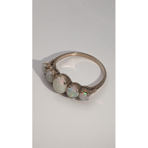 144 - A gold and 5 stone opal ring tested as 9ct gold 2g
Location: RING
If there is no condition report sh... 