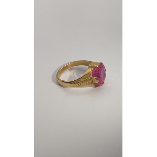 154 - An Indian gold and ruby coloured ring, 6.6g, tested as 22ct gold, size R 1/2 Location: CAB 2
If ther... 