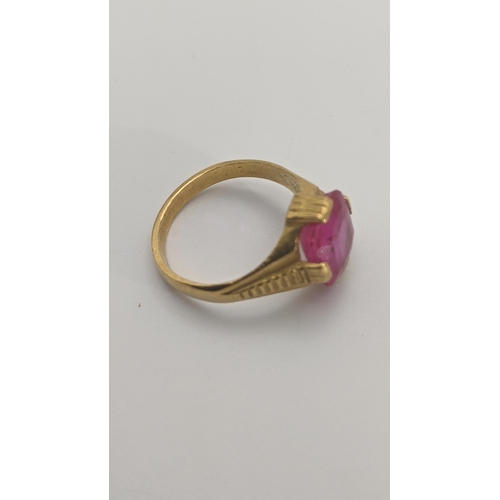 154 - An Indian gold and ruby coloured ring, 6.6g, tested as 22ct gold, size R 1/2 Location: CAB 2
If ther... 