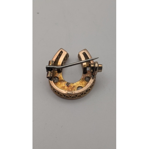 157 - A gold and diamond bar brooch fashioned as a horseshoe, tested as 14ct gold 4g, together with a fash... 