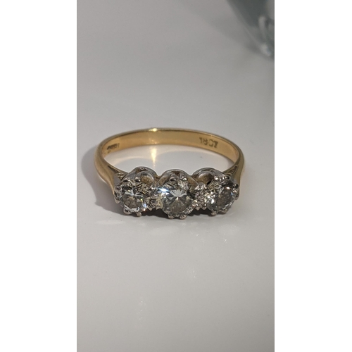 162 - An 18ct gold three-stone diamond ring size Q 1/2 Location: RING
If there is no condition report show... 