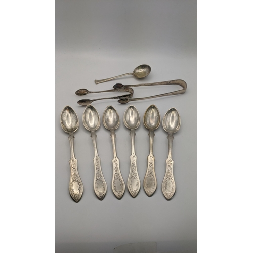 174 - A set of six white metal, possibly Romanian, teaspoons stamped 750 having engraved floral terminals,... 