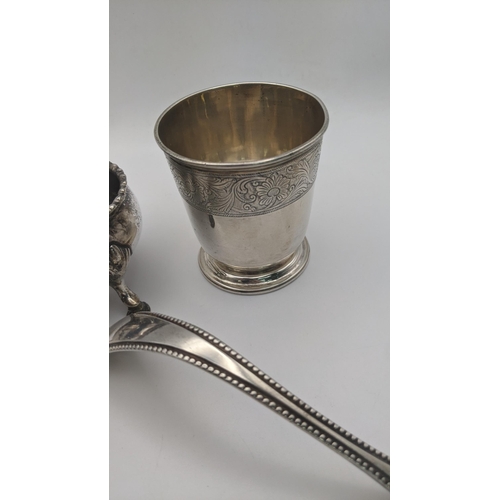 176 - Silver to include a decanter label, salts A/F, ladle and eggcup, along with a white metal pot having... 
