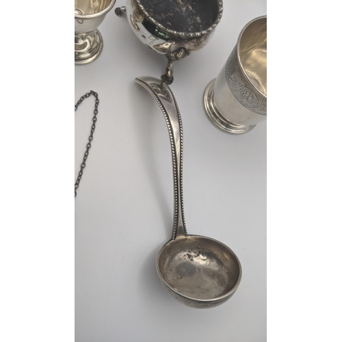176 - Silver to include a decanter label, salts A/F, ladle and eggcup, along with a white metal pot having... 