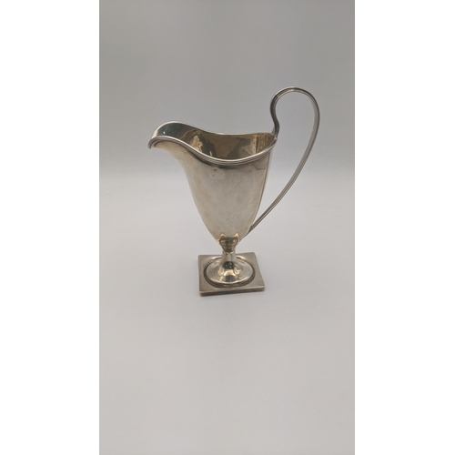 179 - A silver cream jug on a square formed base 13.5cm h, 87.7g Location:5.1
If there is no condition rep... 