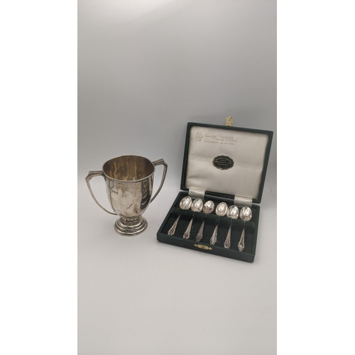 180 - Silver to include a twin handled cup on a three tier base hallmarked London 1948, together with a se... 