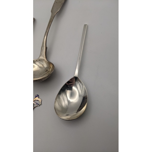 187 - Silver to include a pair of sauce ladles, a napkin ring, and two spoons, 139g and silver and glass p... 