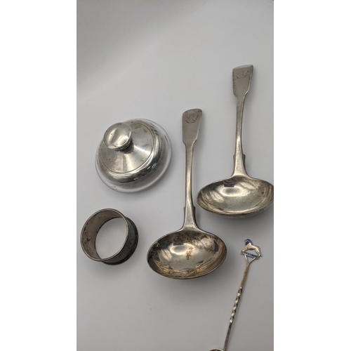 187 - Silver to include a pair of sauce ladles, a napkin ring, and two spoons, 139g and silver and glass p... 