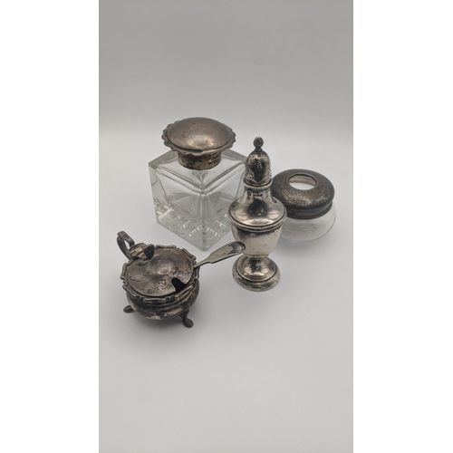 192 - Silver to include a pepper pot, mustard pot and two dressing table jars, total weight- excluding gla... 