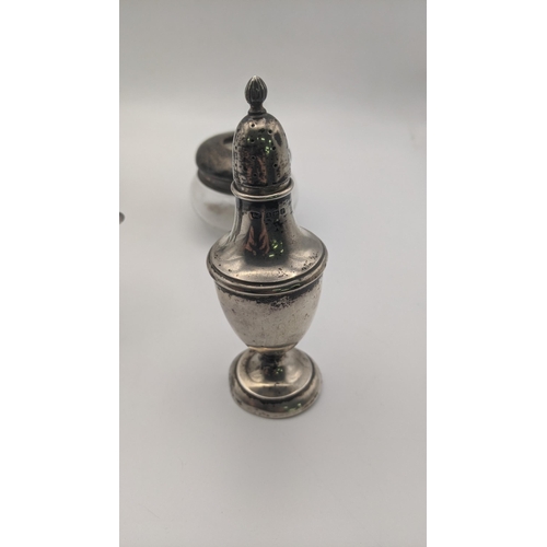 192 - Silver to include a pepper pot, mustard pot and two dressing table jars, total weight- excluding gla... 