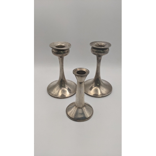 193 - A pair of weighted candle sticks 14cm H and one other 
Location:A3B
If there is no condition report ... 