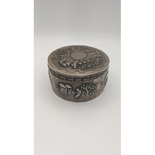 194 - An Indian white metal lidded pot with embossed decoration and repeating boarders 201g
Location:A3B
I... 