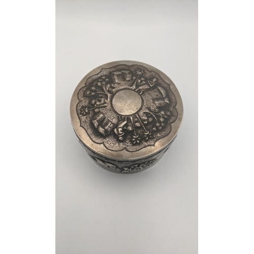 194 - An Indian white metal lidded pot with embossed decoration and repeating boarders 201g
Location:A3B
I... 