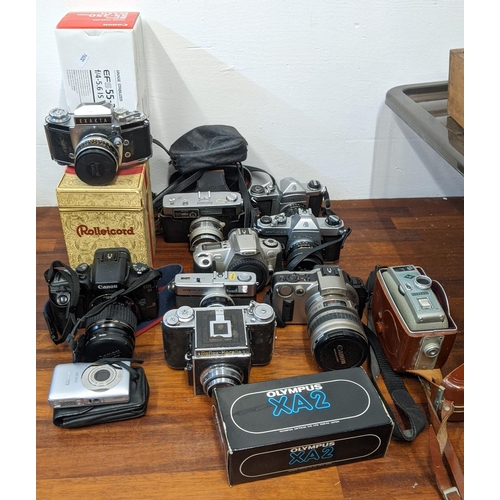 202 - Photographic cameras and accessories to include Olympus Trip 35, an Asahi Pentax Spotmatic F and Exa... 