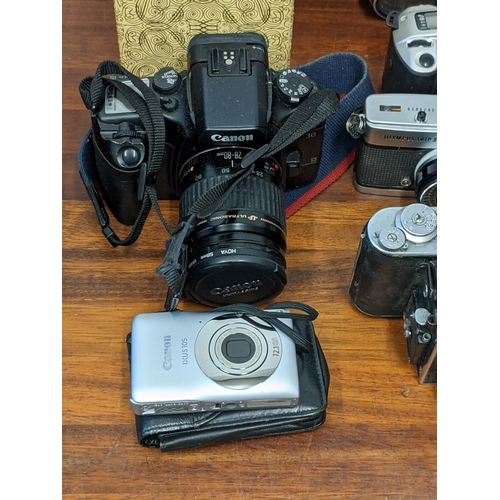 202 - Photographic cameras and accessories to include Olympus Trip 35, an Asahi Pentax Spotmatic F and Exa... 