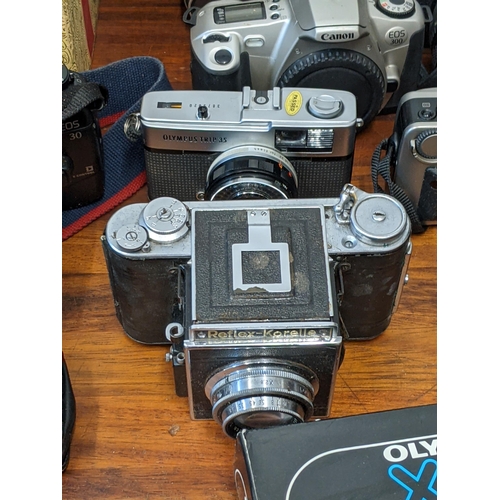 202 - Photographic cameras and accessories to include Olympus Trip 35, an Asahi Pentax Spotmatic F and Exa... 