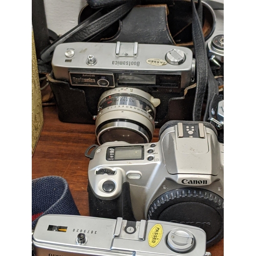 202 - Photographic cameras and accessories to include Olympus Trip 35, an Asahi Pentax Spotmatic F and Exa... 