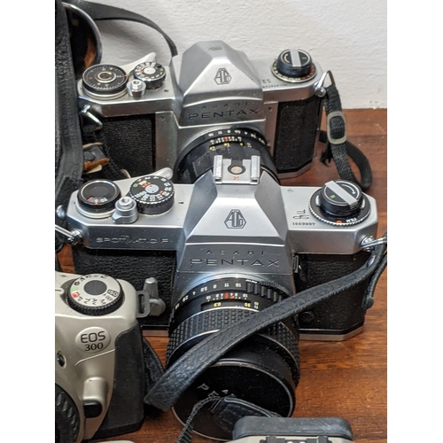 202 - Photographic cameras and accessories to include Olympus Trip 35, an Asahi Pentax Spotmatic F and Exa... 