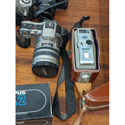 202 - Photographic cameras and accessories to include Olympus Trip 35, an Asahi Pentax Spotmatic F and Exa... 