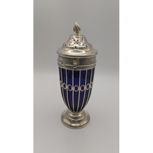 211 - A Haseler Brothers silver sugar caster hallmarked London 1900 with a pierced lined body and a blue g... 