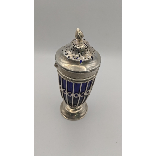 211 - A Haseler Brothers silver sugar caster hallmarked London 1900 with a pierced lined body and a blue g... 