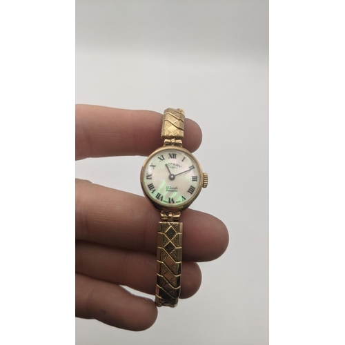 226 - A 9ct gold ladies Rotary manual wind wrist watch on a later expanding strap and having a mother of p... 