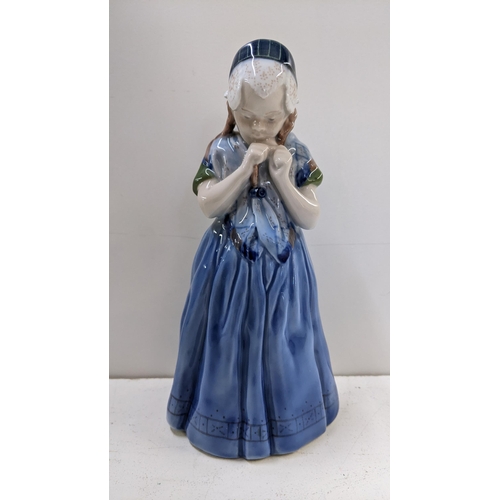 264 - A Royal Copenhagen porcelain figure 'girl from Barnholm' number 1323, 21h 
Location:2.1
If there is ... 