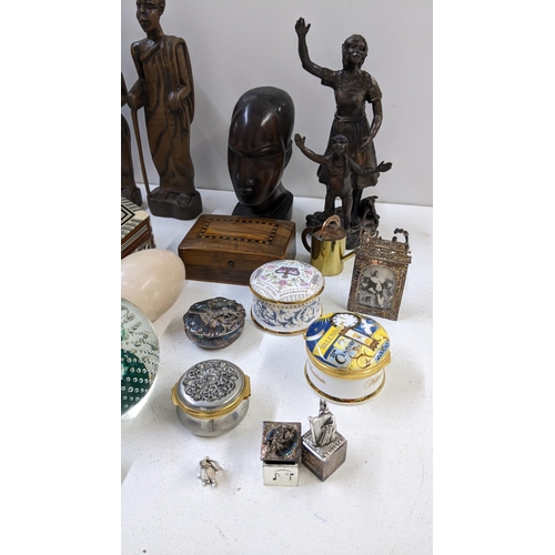 274 - A mixed lot to include African tree carved busts, bronzed figural group, porcelain trinket boxes and... 