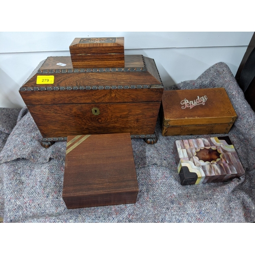 279 - A tea caddy of sarcophagus form and four boxes, one with mother of pearl inlay, one with hinged lid ... 