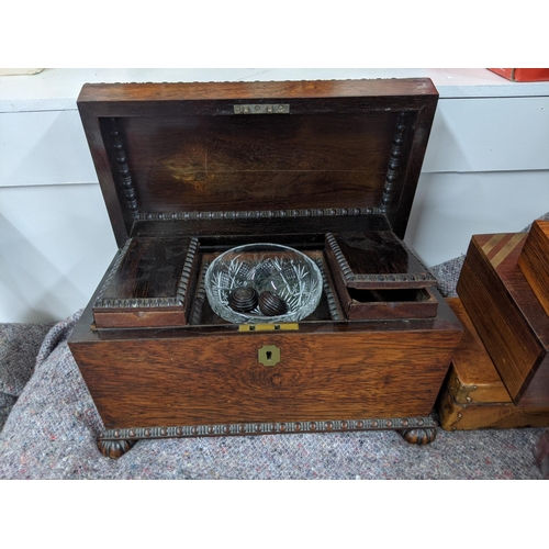 279 - A tea caddy of sarcophagus form and four boxes, one with mother of pearl inlay, one with hinged lid ... 