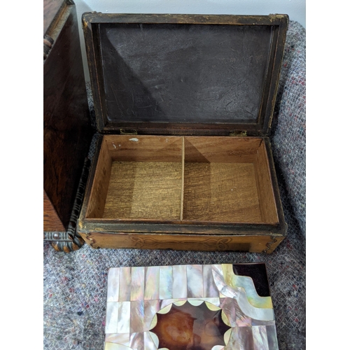 279 - A tea caddy of sarcophagus form and four boxes, one with mother of pearl inlay, one with hinged lid ... 