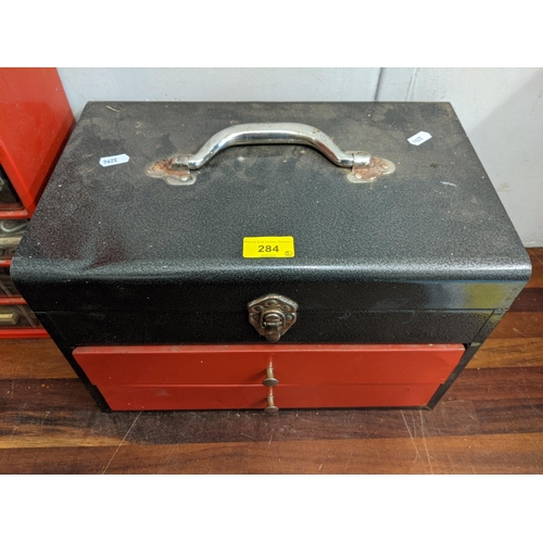 284 - A tool chest with a storage unit containing screws, plugs, pins, caps and other items
Location:RAM
I... 