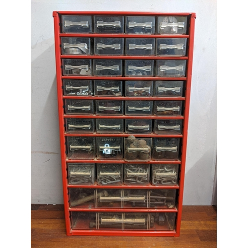 284 - A tool chest with a storage unit containing screws, plugs, pins, caps and other items
Location:RAM
I... 