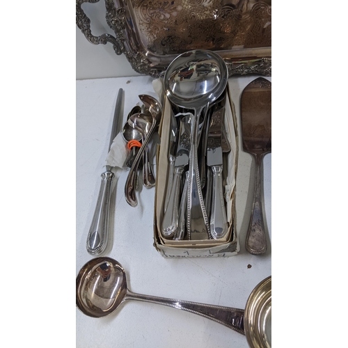 327 - Mixed silver plate to include a collection of Harrods cutlery, twin handled tray and other items
Loc... 