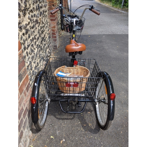 371 - A Jorvik tricycle in black with a basket to the front and rear, with a singular wicket basket, handl... 