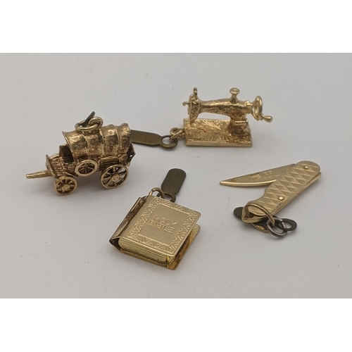 88 - Four 9ct gold charms to include on fashioned as a pocket knife, another as a sewing machine and two ... 