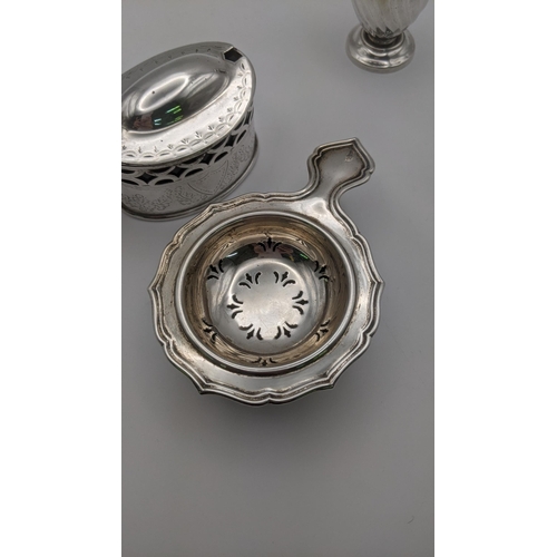 92 - Silver to include a tea strainer hallmarked Birmingham 1947, together with a pepper pot and a mustar... 