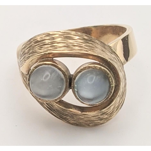 95 - A 9ct gold ring set with two moonstone cabochons, size Q, 6.8g, Location: CAB 2
If there is no condi... 