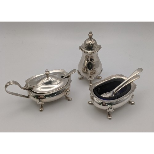 126 - A set of three silver condiment set to include a mustard pot, pepper pot and salts, total weight exc... 