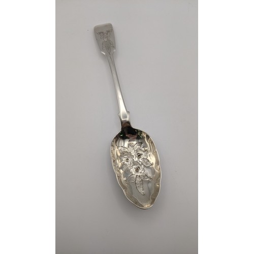 127 - A William Fountain fiddle pattern berry spoon hallmarked London 1838 having an embossed bowl and eng... 