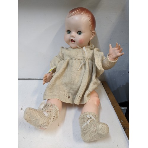 322 - A c 1950s dolls jointed arms & legs blue sleeping eyes and open mouth in original clothes with non f... 