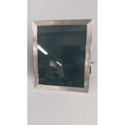 212 - A silver engine turned photo frame hallmarked Birmingham 1967 28.5cm x 23.5cm Location:R2.2
If there... 