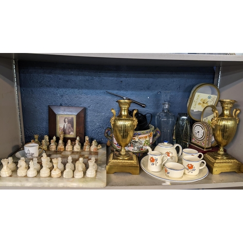 335 - A mixed lot to include an onyx chessboard, two pairs of binoculars, a Wedgwood clock and other items... 