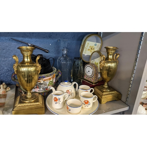 335 - A mixed lot to include an onyx chessboard, two pairs of binoculars, a Wedgwood clock and other items... 