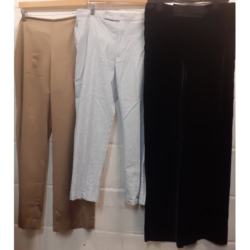 410 - A large mixed lot of ladies clothing to include an Emporio Armani crimson full length satin skirt Eu... 