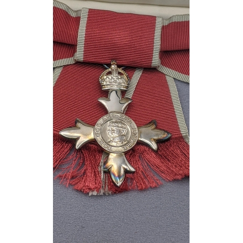 232 - A mixed lot to include a cased Order of the British Empire medal, Civilian Female MBE, together with... 